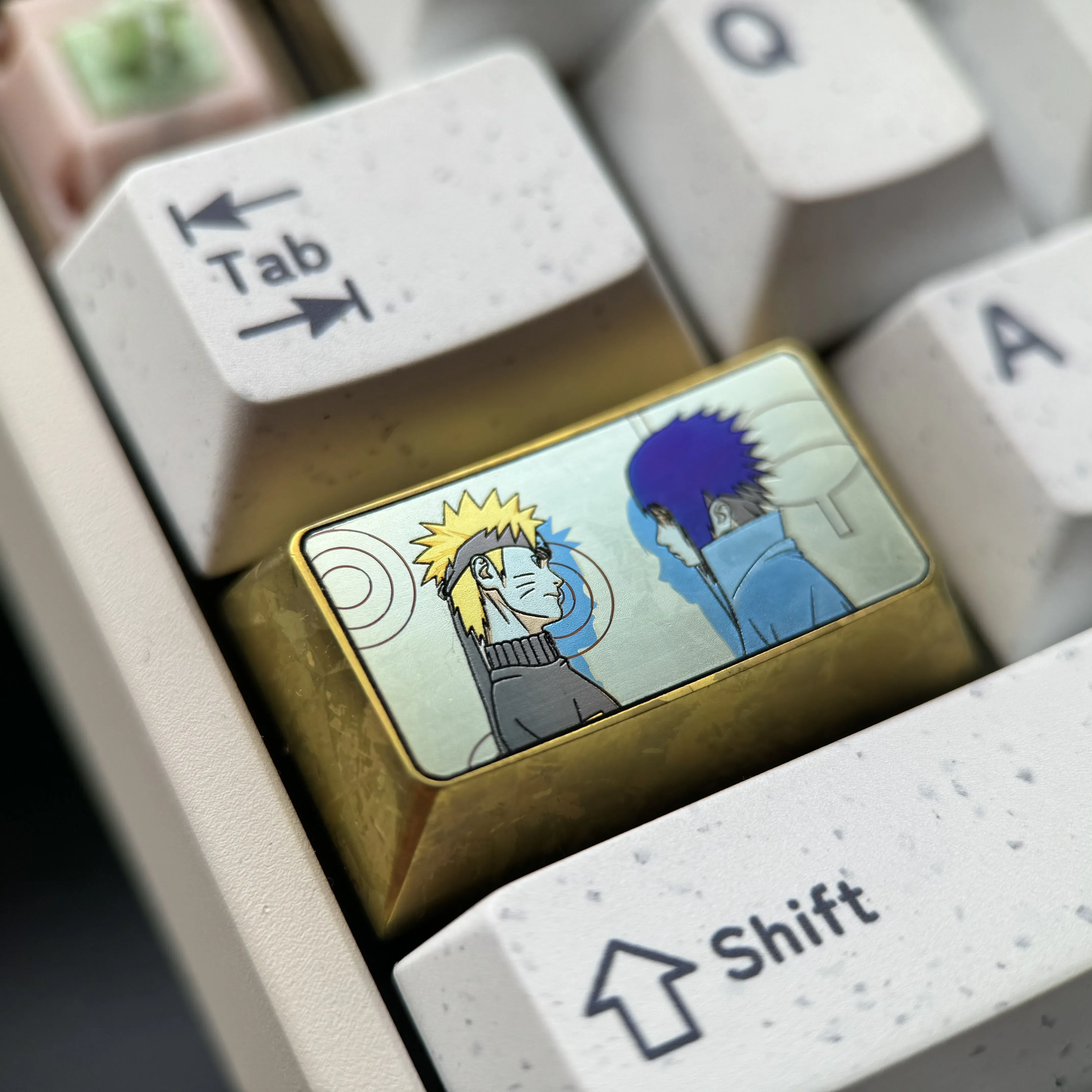 Collection of Premium Naruto and Sasuke Titanium Artisan Keycaps, displayed from multiple angles, highlighting vibrant anime character art.