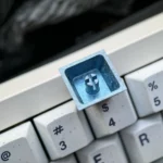 Diverse angles of the Ninja Gaiden: Ryu Hayabusa Keycap in Ice Crystal Grey. Reveals its sleek metallic finish and premium ssetup.