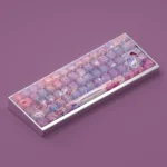 Vibrant gallery of Dreamscape Delight Oil Painting Keycaps Set, featuring whimsical landscapes and artistic side-lit legends from multiple angles.