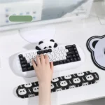 Gallery of the adorable Chubby Panda Ergonomic Silicone Wrist Rest, showcasing its soft, comfortable support and whimsical design from multiple selection.