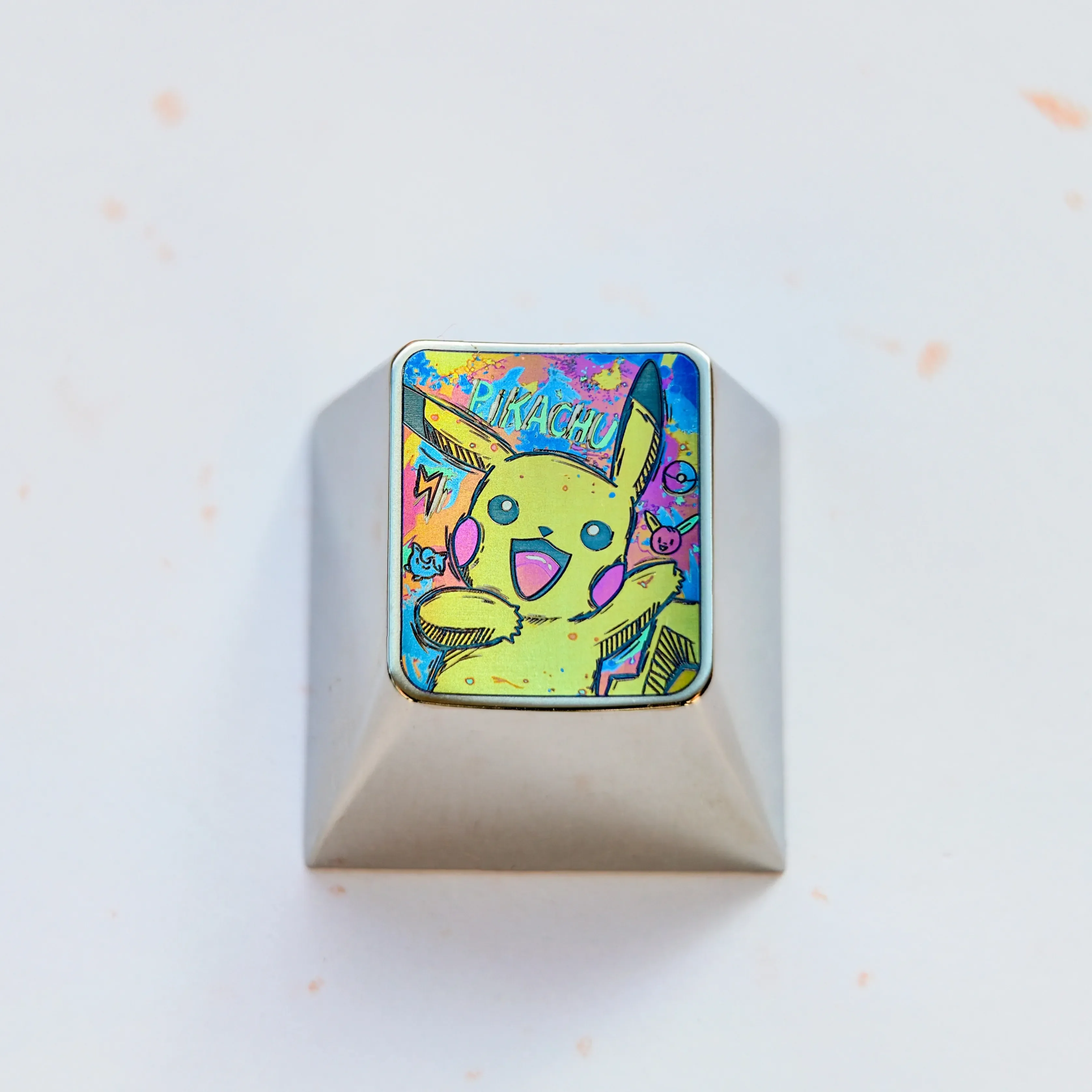 Iconic Pikachu titanium alloy keycap for mechanical keyboards, showcasing premium craftsmanship and a vibrant metallic sheen.