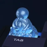 Multiple angles of the handcrafted Pingu Ice Sculpture ESC keycap, showcasing its whimsical translucent resin design and charming ice figurine design.