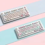 Charming pink cat PBT dye-sub keycaps set displayed from various angles, highlighting adorable feline motifs and the dreamy pastel aesthetic.