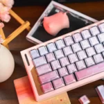 Celestial Pink Gradient Keycaps Set showcasing dye-sub PBT and backlit legends, evoking an ethereal, dreamy aesthetic for custom mechanical keyboards.