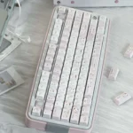 Collection of whimsical Powder Puff Cherry Keycap Set, showcasing the dreamy soft pink design and premium five-sided dye-sublimation for a whimsical touch.