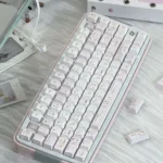 Full set of whimsical Powder Puff Cherry Keycap Set from different angles, highlighting their dreamy soft pink and premium dye-sublimation.