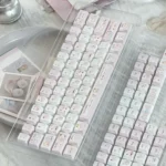 Gallery of Powder Puff Cherry Keycap Set, highlighting the whimsical design and premium five-sided dye-sublimation from all captivating angles.