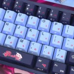 Enchanting Rabbit Hole Side-Printed PBT Keycaps Set gallery: whimsical VOCALOID legends subtly glowing on various compact backlit keyboards.