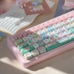 Whimsical Raspberry Ice PBT Keycap Set for mechanical keyboards. Premium keycaps with artistic pastel pink, creamy white dessert, and berry designs.