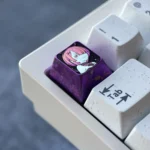 Multiple views of the Ram Premium Titanium Halloween Keycap, revealing its mystical anodized purple metal artistry and intricate Halloween-themed.