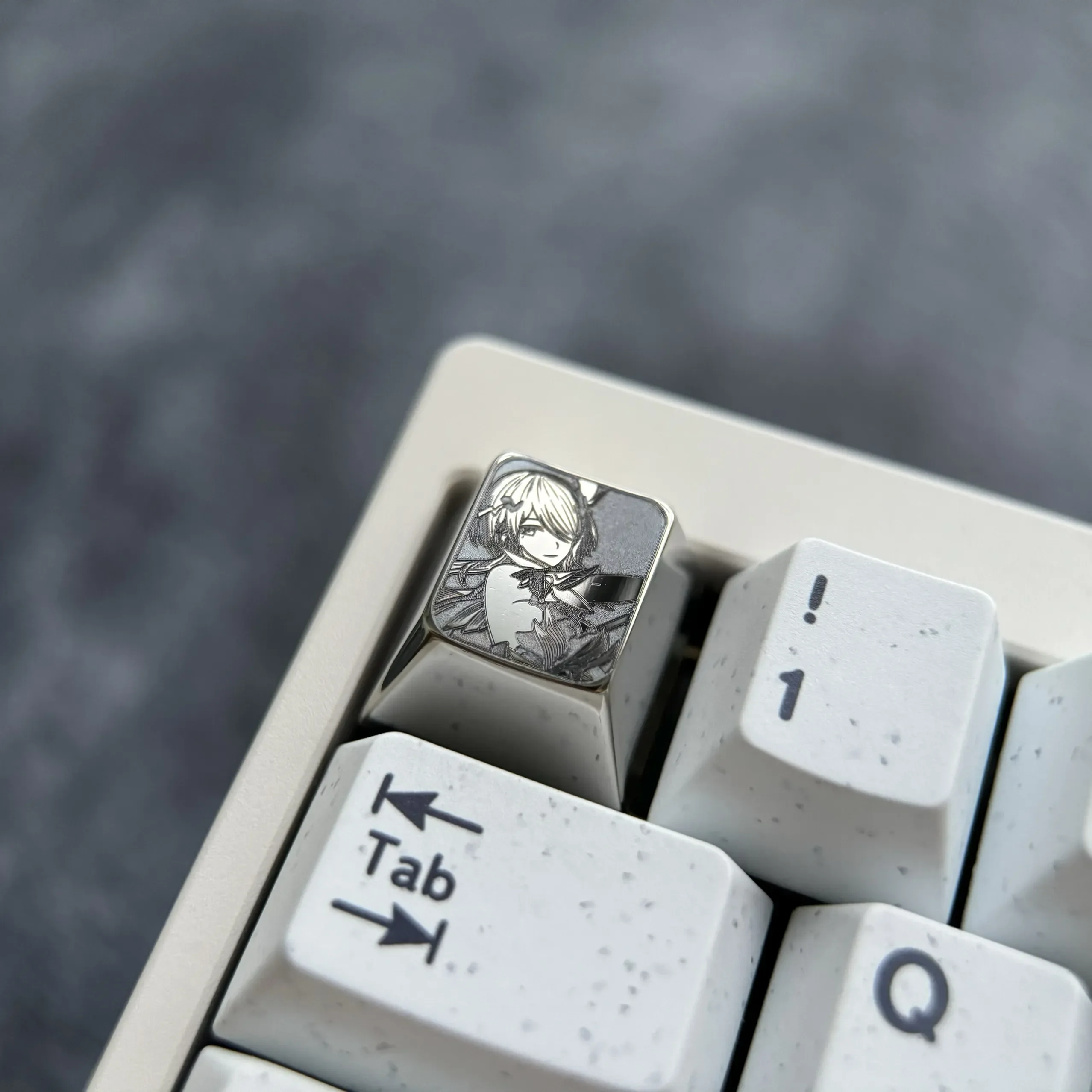See the exquisite Rita Rossweisse titanium artisan keycap from all angles. Meticulously sculpted with fiery orange details and a premium metallic design.