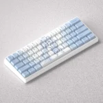 Vibrant Roxy Mushoku Tensei PBT keycaps set displayed from multiple playful angles, showcasing exclusive fan-crafted anime art and durable PBT.