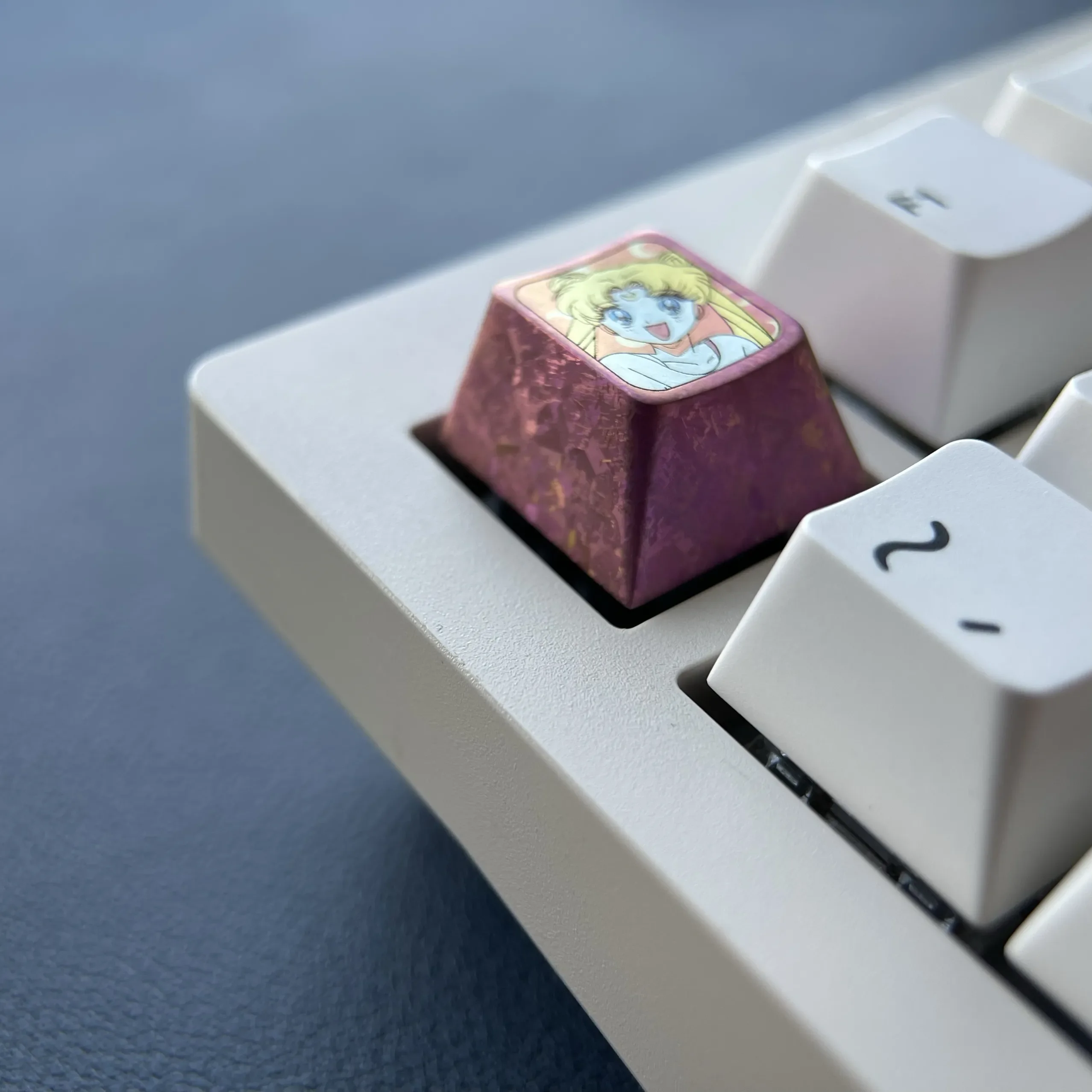 Lustrous red titanium Sailor Moon ESC keycap, a premium custom anime accessory enhancing any keyboard with enchanting iconic design.