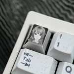 Premium Sakurajima Mai engraved titanium keycap in a gallery of views, highlighting intricate anime art and precise metallic finish details.