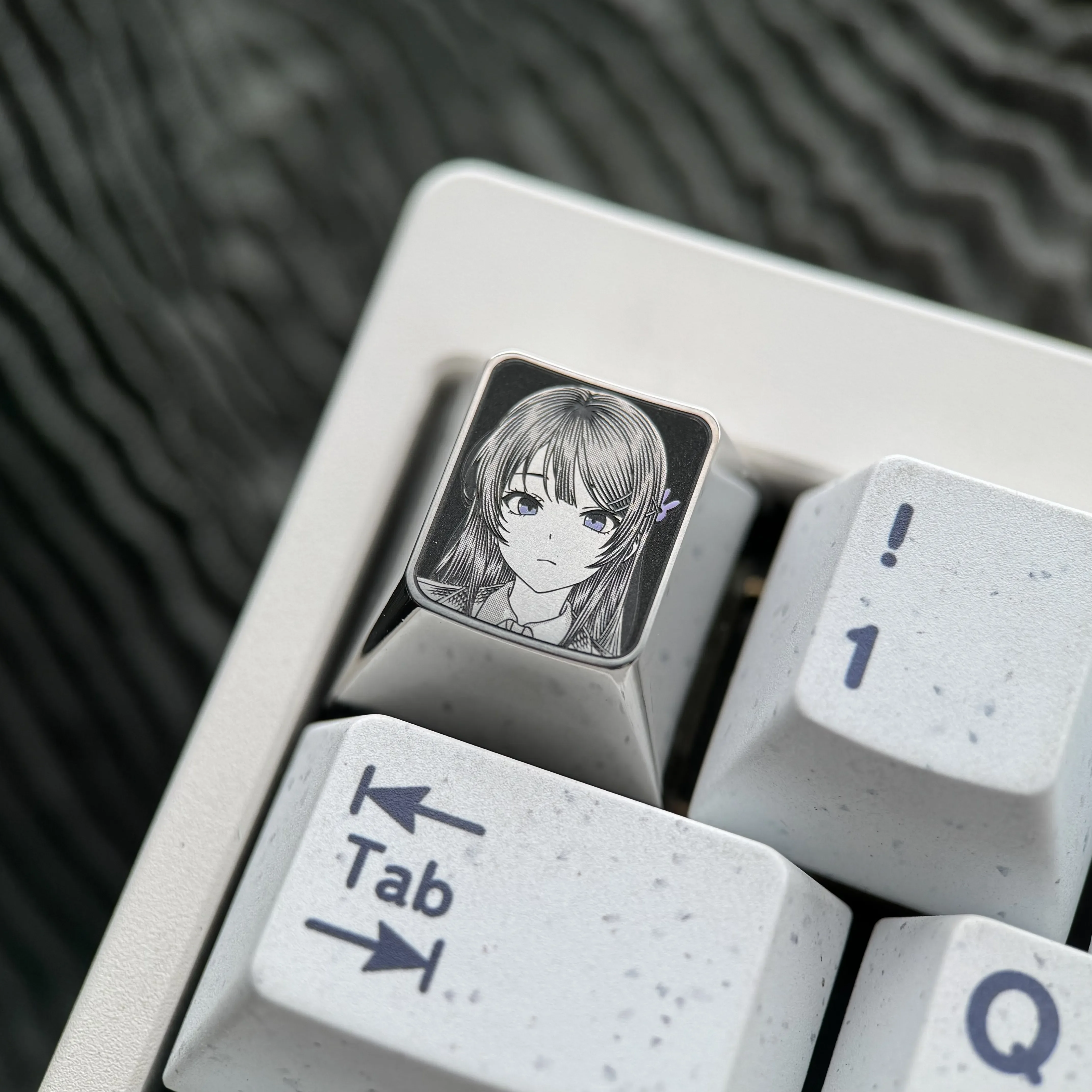 Premium Sakurajima Mai engraved titanium keycap in a gallery of views, highlighting intricate anime art and precise metallic finish details.