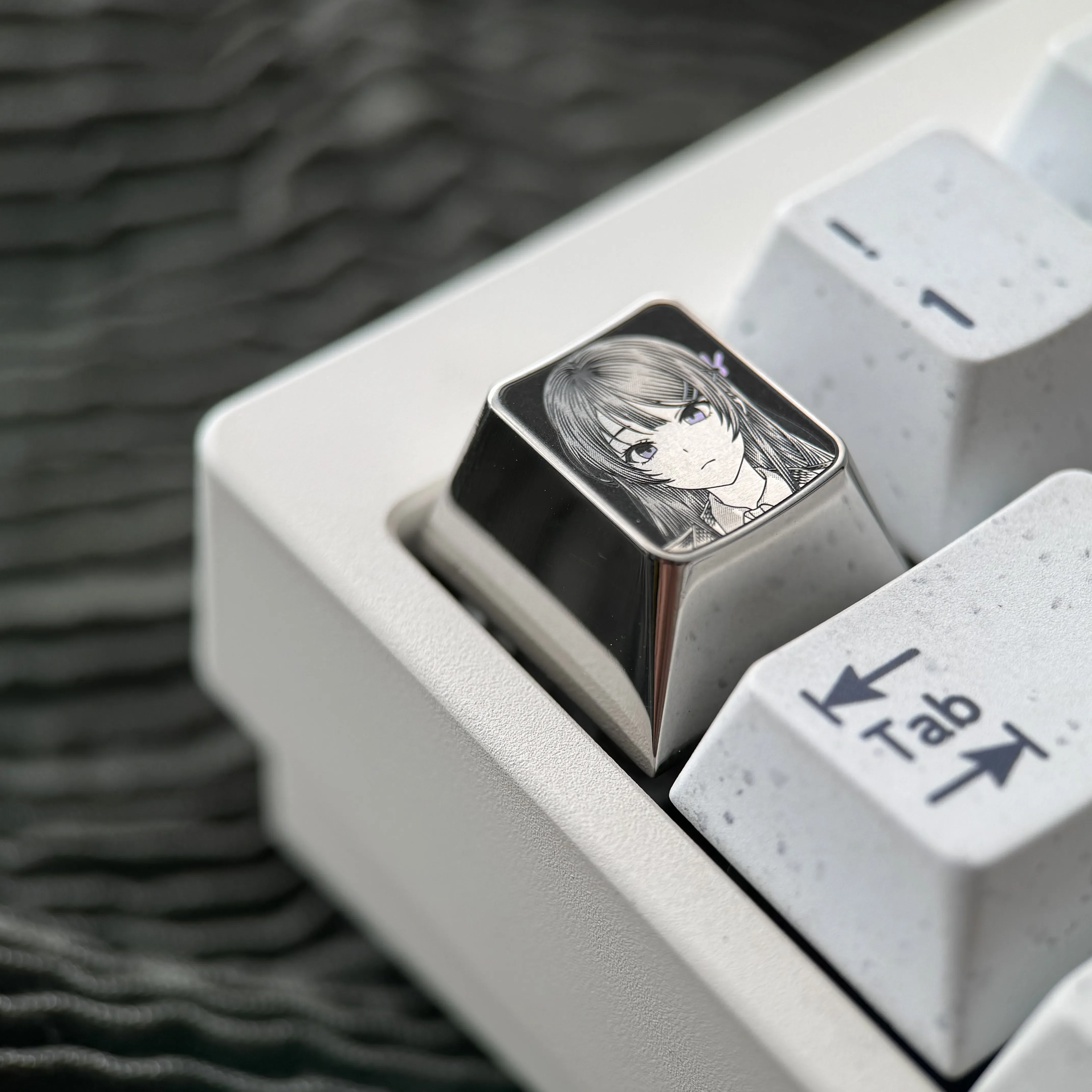 Gallery of the premium Sakurajima Mai engraved titanium keycap, showcasing intricate anime art and precise metallic details from various angles.