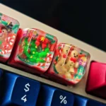 Gallery of the handcrafted Christmas resin keycap, highlighting the whimsical Santa figure perfectly cast in vibrant, clear resin. A unique festive gift.