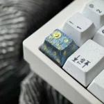 Hand-carved titanium Van Gogh Starry Night keycap gallery. See its intricate relief texture and metallic sheen from various angles.