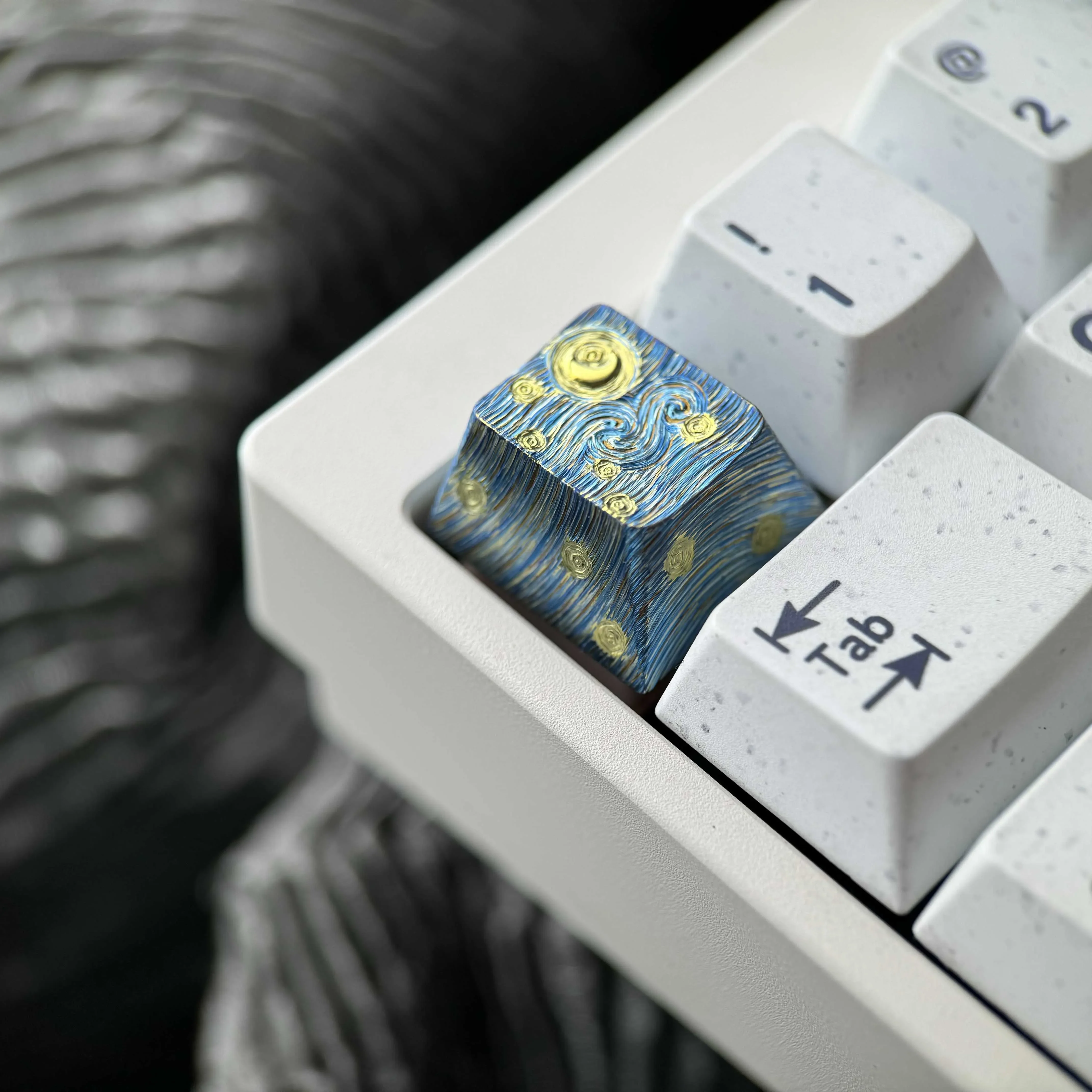 Hand-carved titanium Van Gogh Starry Night keycap gallery. See its intricate relief texture and metallic sheen from various angles.