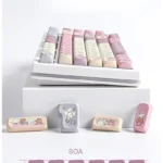 Explore the delightful Taro Mochi Keycaps Set, showcasing double-shot SOA profile keycaps in soft pastel purples and creams from various playful design.