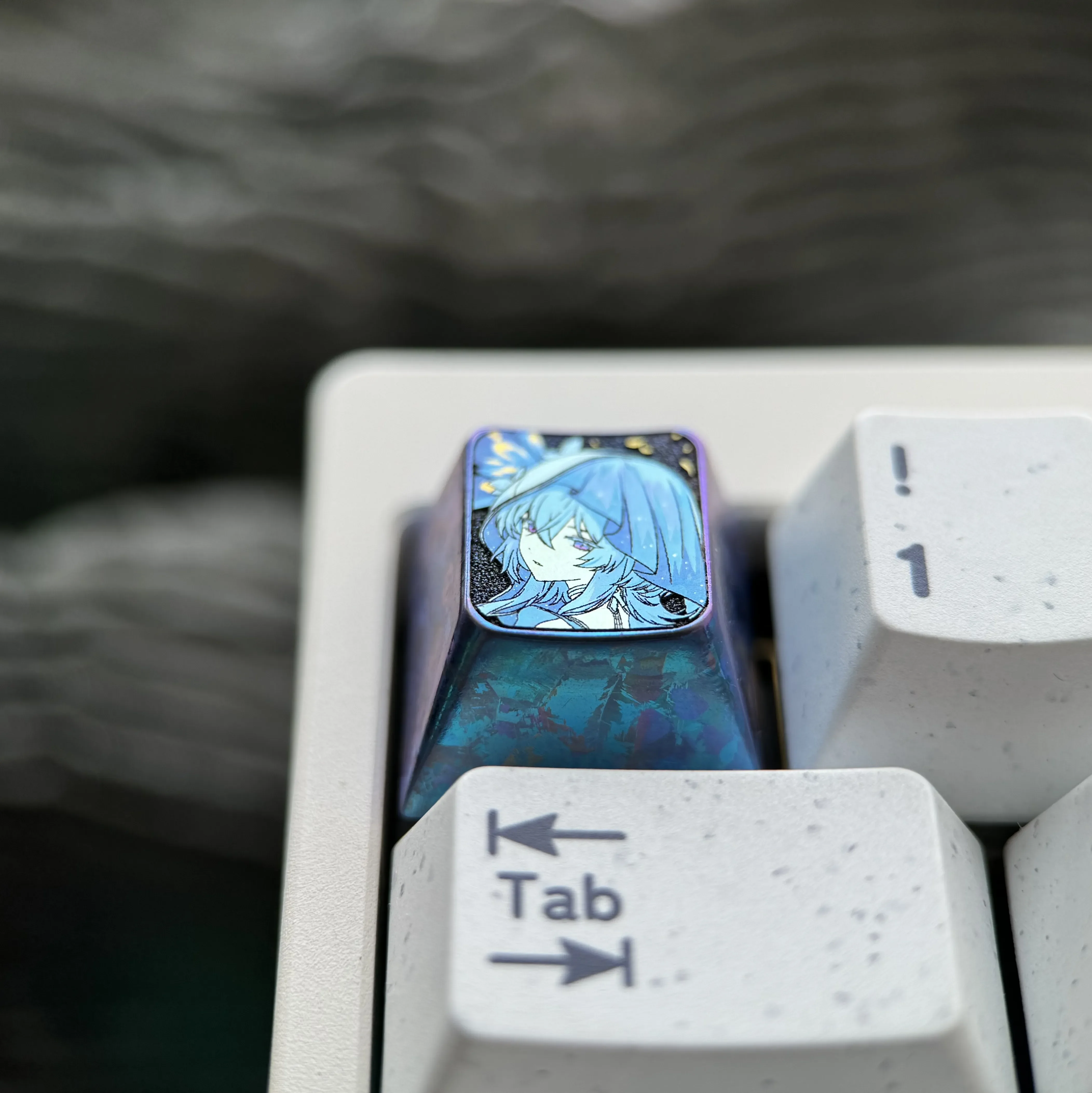 Multiple angles of The Shorekeeper Titanium Keycap, showcasing its intricate design and vibrant premium titanium alloy craftsmanship.
