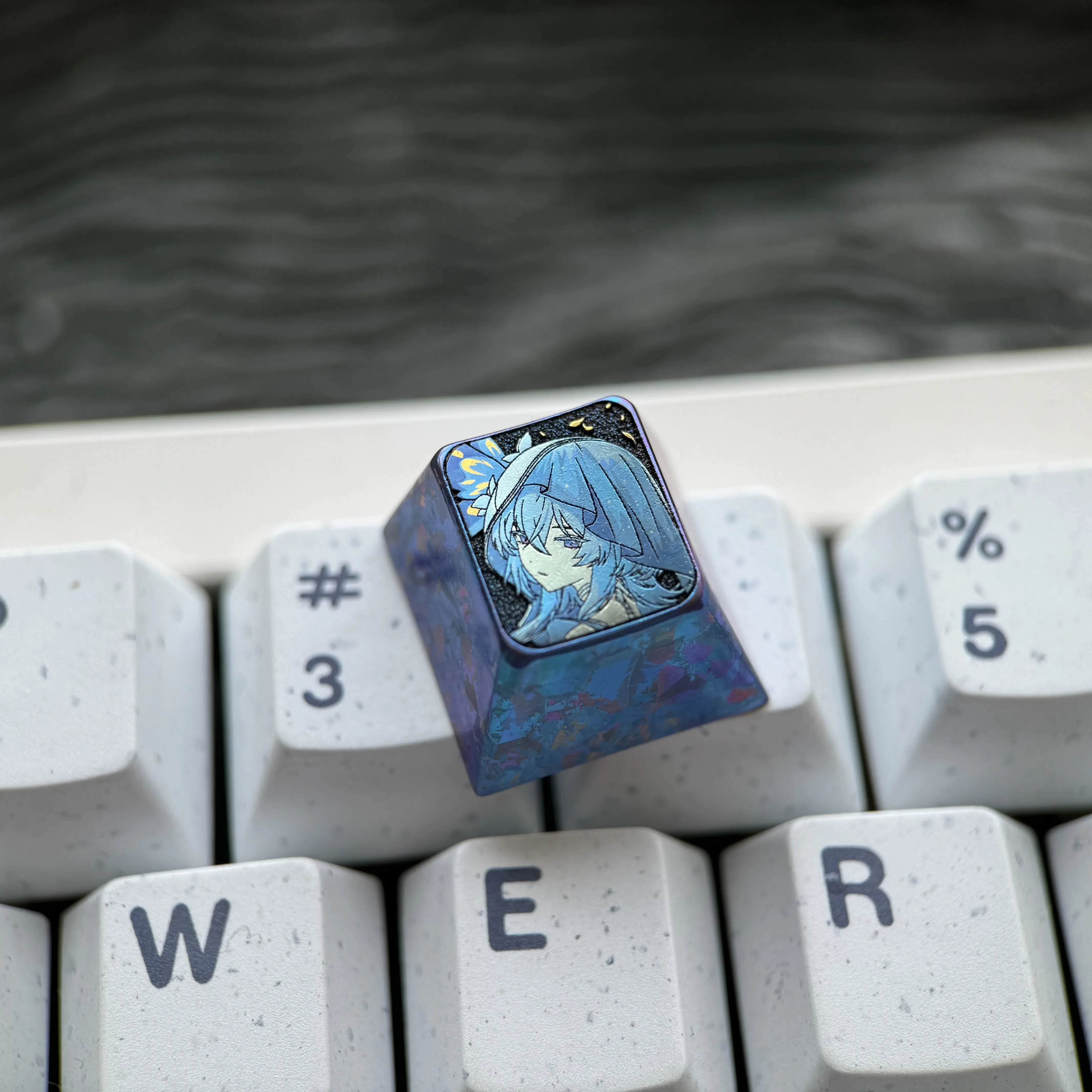 Detailed views of The Shorekeeper Titanium Keycap, a premium artisan ESC key for custom mechanical keyboards with intricate design.
