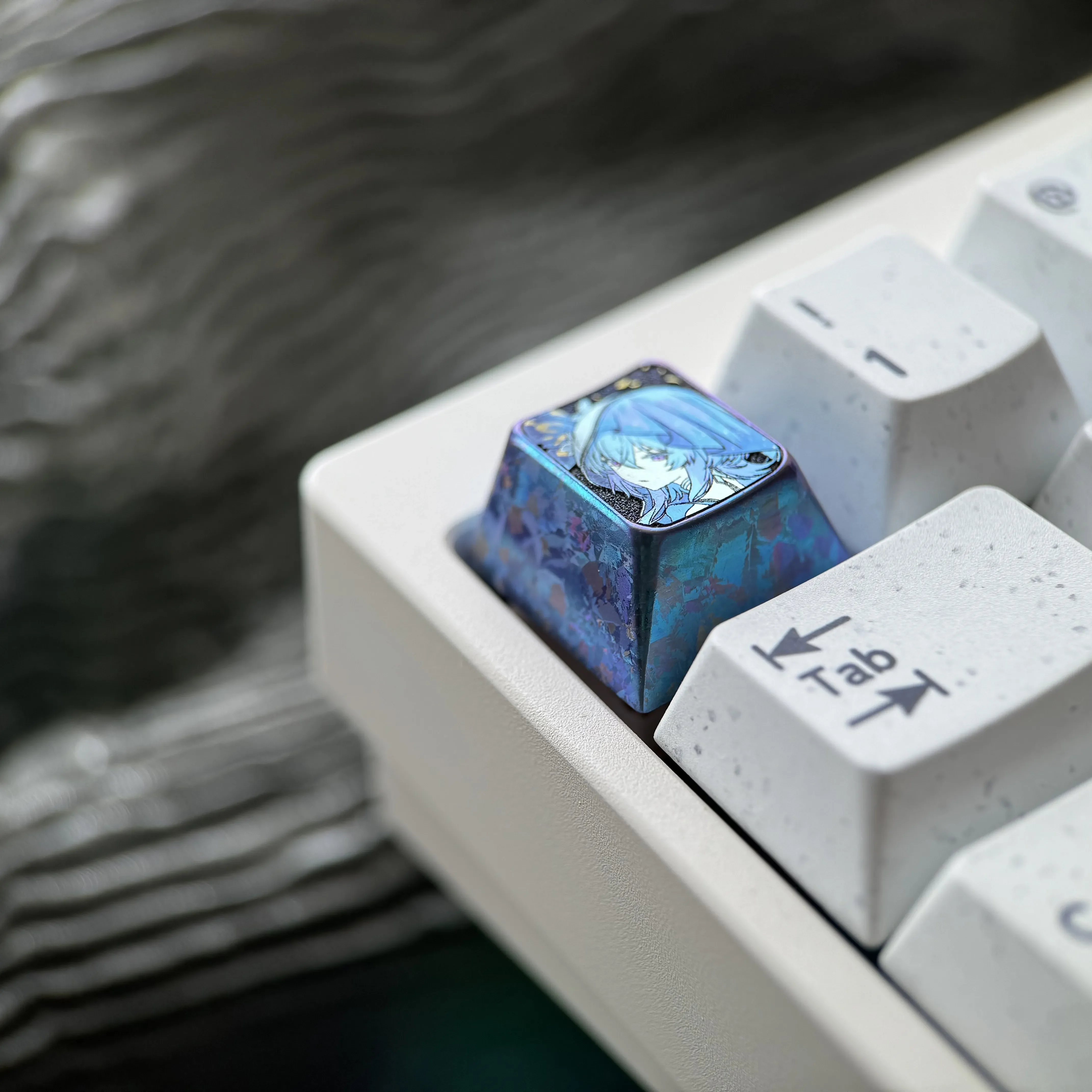 View The Shorekeeper Titanium Keycap from various angles, revealing the intricate artistry of this premium titanium artisan keycaps vibrant setup.