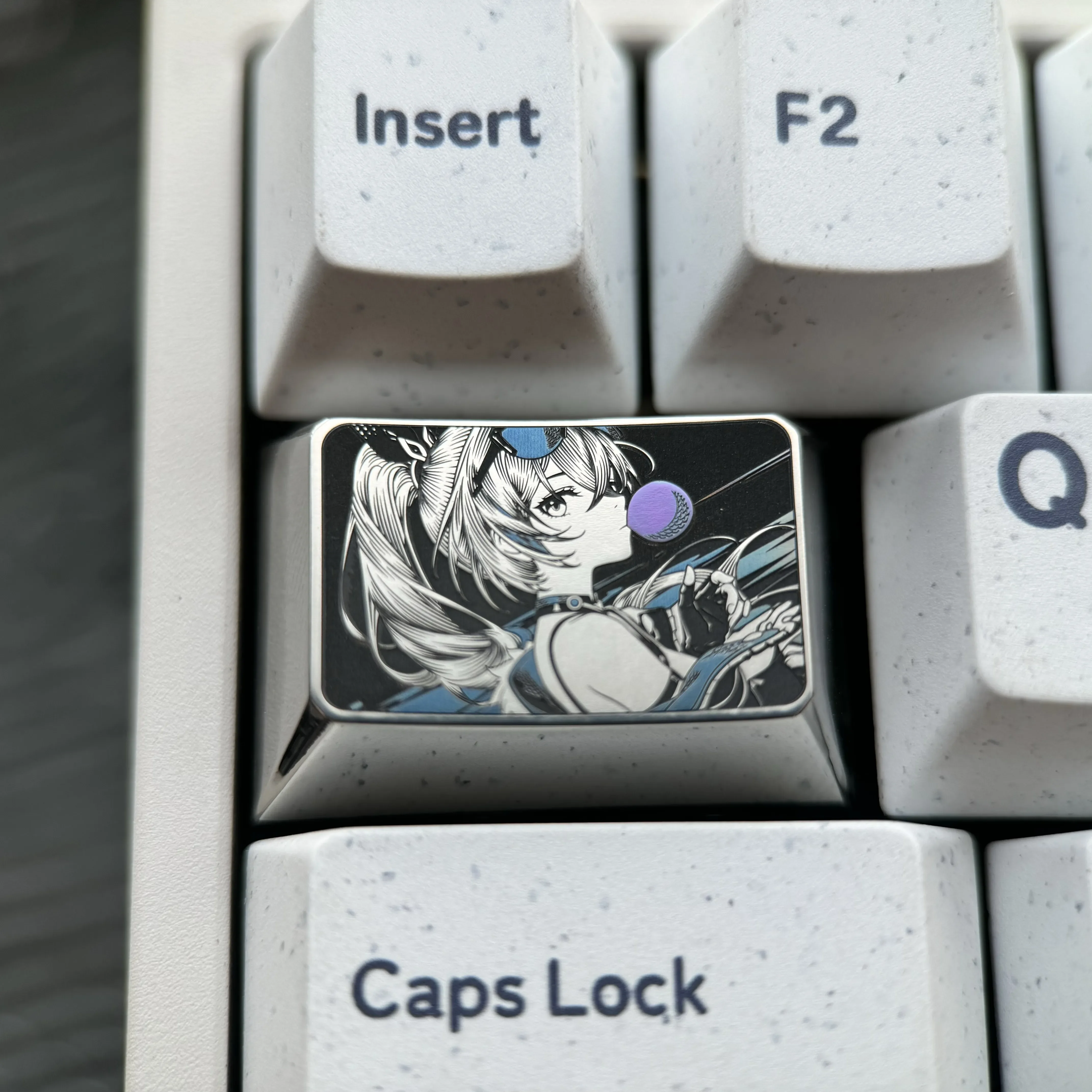 Multiple angles of the Silver Wolf precision-engraved titanium anime keycap, showcasing its intricate metallic art and artisan craftsmanship for your keyboard.
