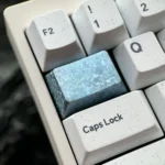 Product display of the strikin Ice Crystal Titanium Keycap, highlighting its premium titanium alloy and intricate, shimmering jewel-like design.