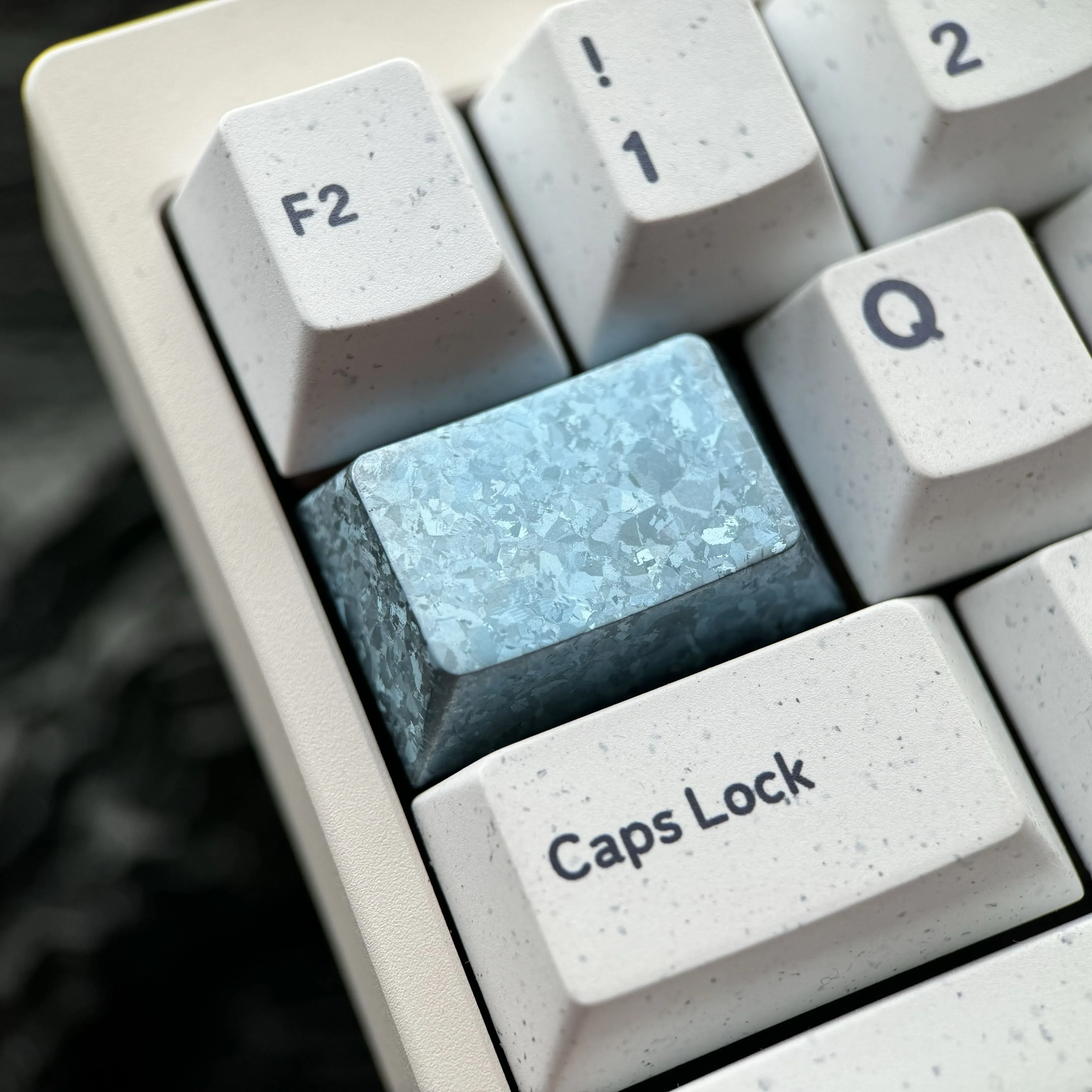 Product display of the strikin Ice Crystal Titanium Keycap, highlighting its premium titanium alloy and intricate, shimmering jewel-like design.