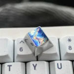 Vibrant Anime Titanium Wave Keycap collection, showcasing its premium metallic finish and dynamic ocean-inspired design from various artistic angles.