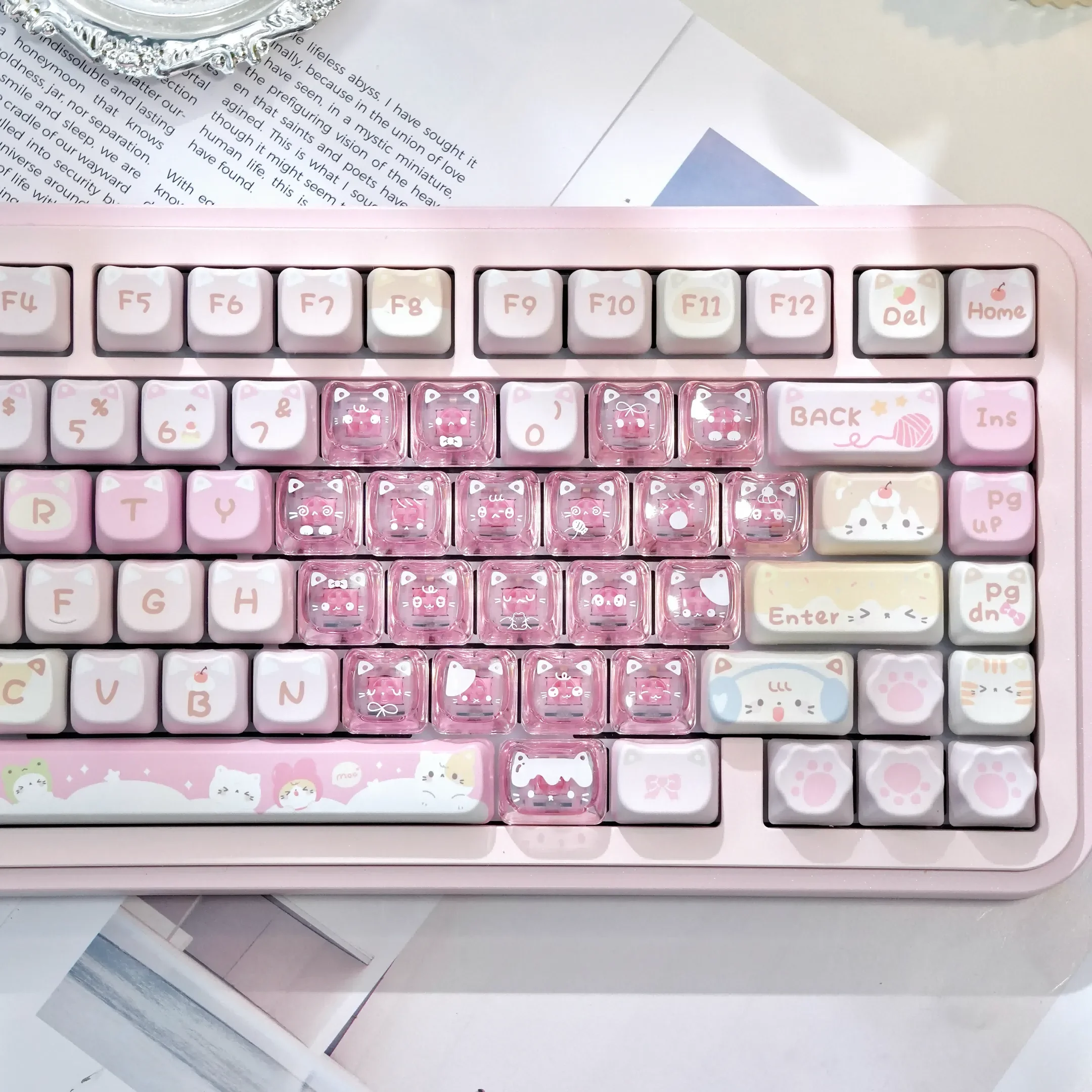 Multiple playful pink transparent heart keycap set with adorable MAO cat designs, displayed from various angles. This 21-key set brings a whimsical touch.
