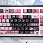 Vibrant product gallery of Playful Pink Transparent Heart Keycap set, showcasing adorable MAO cat designs from various angles.