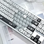 Gallery of Playful Pink Transparent Heart Keycap set, with adorable MAO cat designs from multiple angles, showcasing a whimsical keyboard aesthetic.