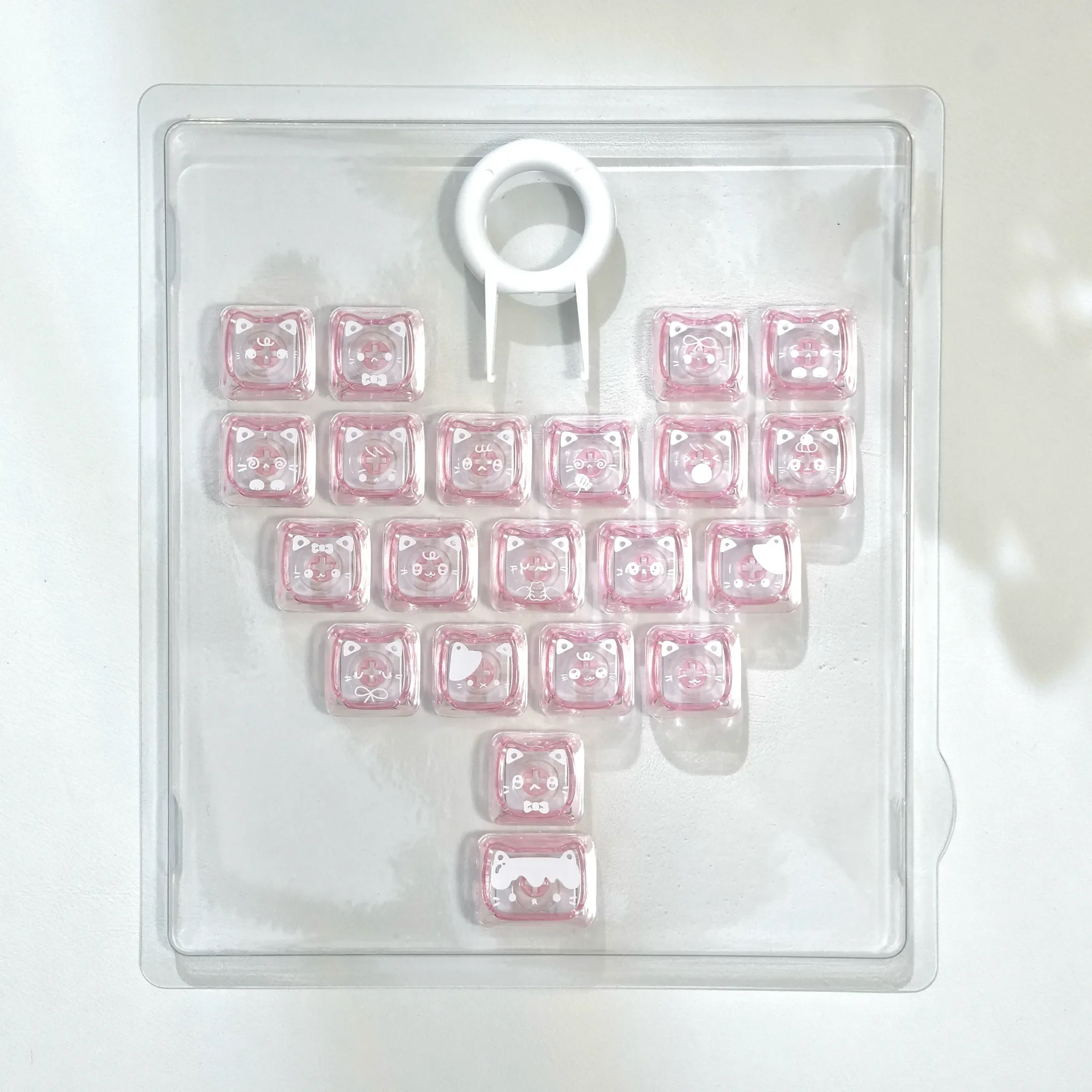 Playful Pink Transparent Heart Keycap set featuring adorable MAO cat designs on a full keyboard setup, highlighting their whimsical deisgn.