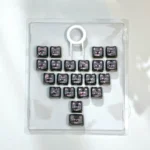 Playful pink transparent heart keycap set featuring adorable MAO cats, showcasing the unique and whimsical desktop aesthetic.