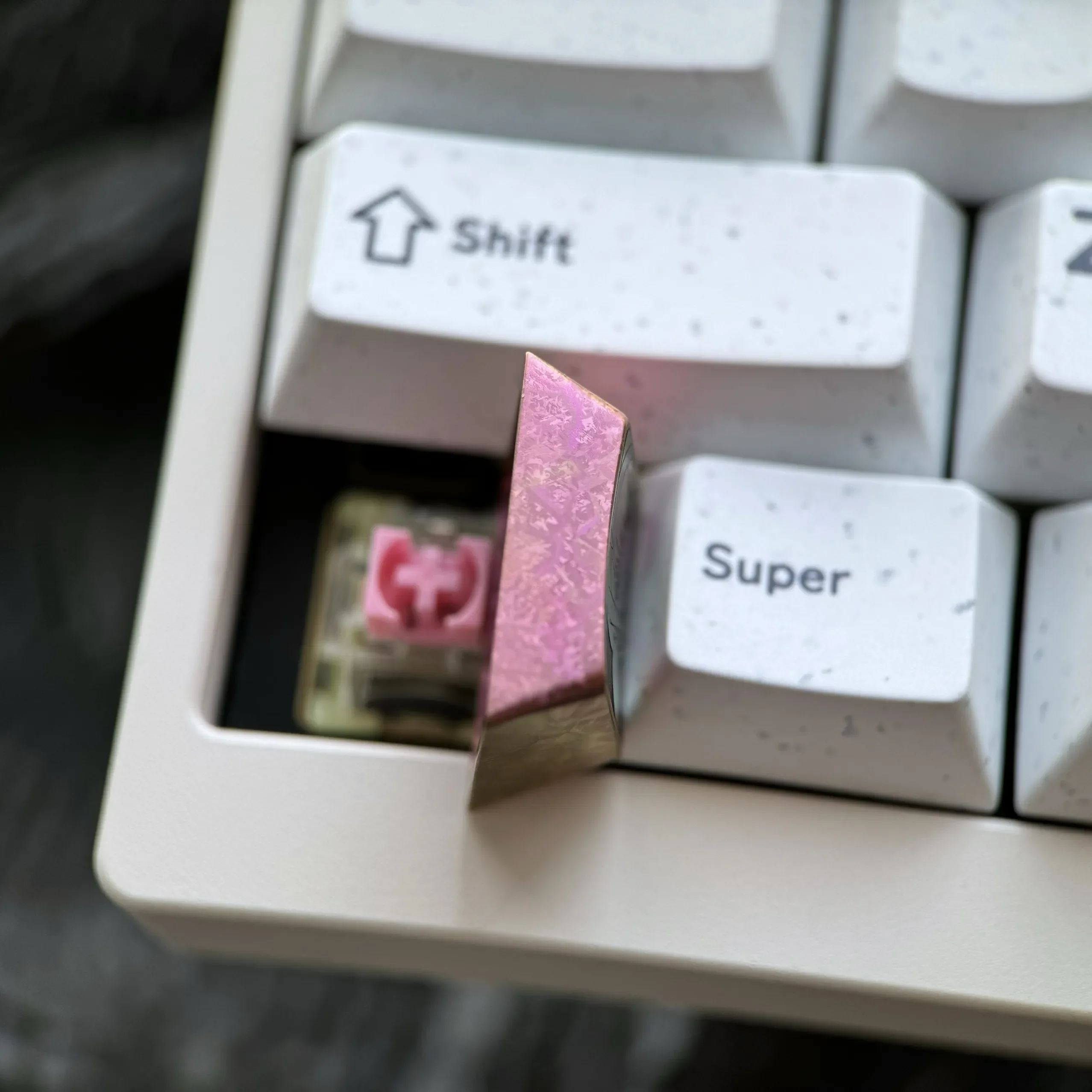 Multiple angles of the premium Zero Two Titanium Keycap, revealing its durable titanium alloy, vivid finish, and exquisite artisan.