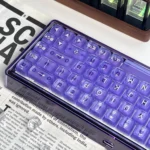 Violet Amber Keyboard gallery displays mesmerizing translucent deep violet with warm amber three-layer craft keycaps from multiple angles.