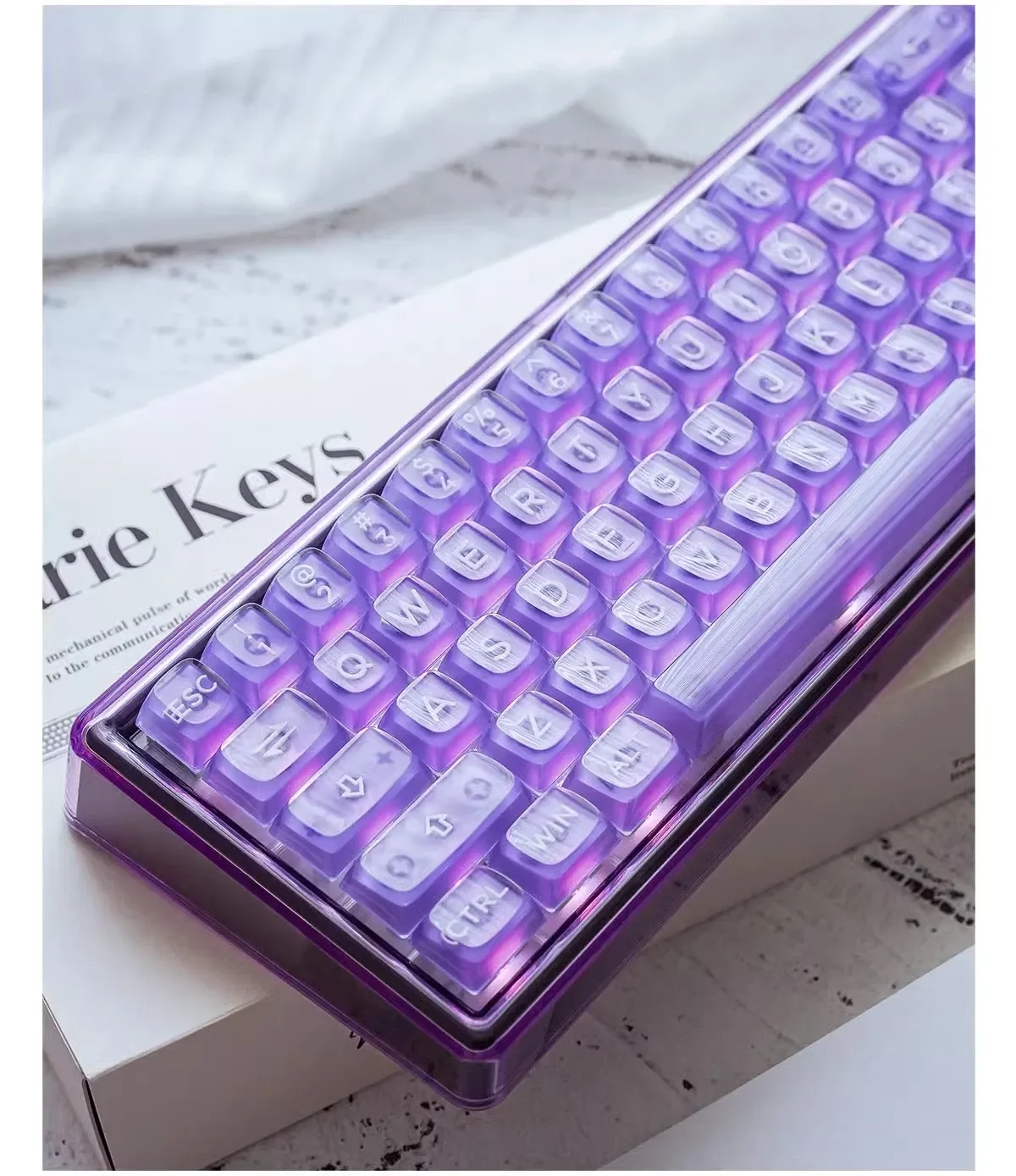 Violet Amber Keyboard with mystical three-layer amber craft keycaps, revealing translucent deep violet and warm amber layers.