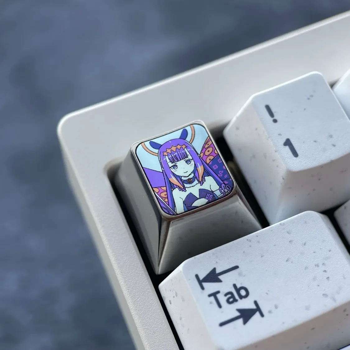 Multiple views of the Virtual YouTuber: Ninomae Ina'Nis Keycaps, revealing its rich purple metallic luster and sleek modern design