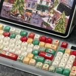 Whimsical Christmas Keycaps set, PBT Dye-Sub MOA profile. View festive holiday characters and symbols from multiple angles, showcasing vibrant design.