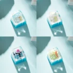 Whimsical handcrafted resin diorama Ice World keycap featuring a cute cartoon penguin playing in a miniature ice world scene.