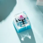 Displaying multiple angles of the artisan Whimsical Miniature Ice World Keycap, highlighting its handcrafted resin diorama and charming design.