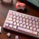 Whimsical pastel pink rabbit tea party keycaps setfor custom mechanical keyboards, showcasing adorable bunnies and delicate motifs from all angles.