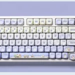 Serene Winter Wonderland PBT dye-sub MOA keycap set, displaying distinct winter keycap set with artistic snow-inspired cool tones and unique characters.