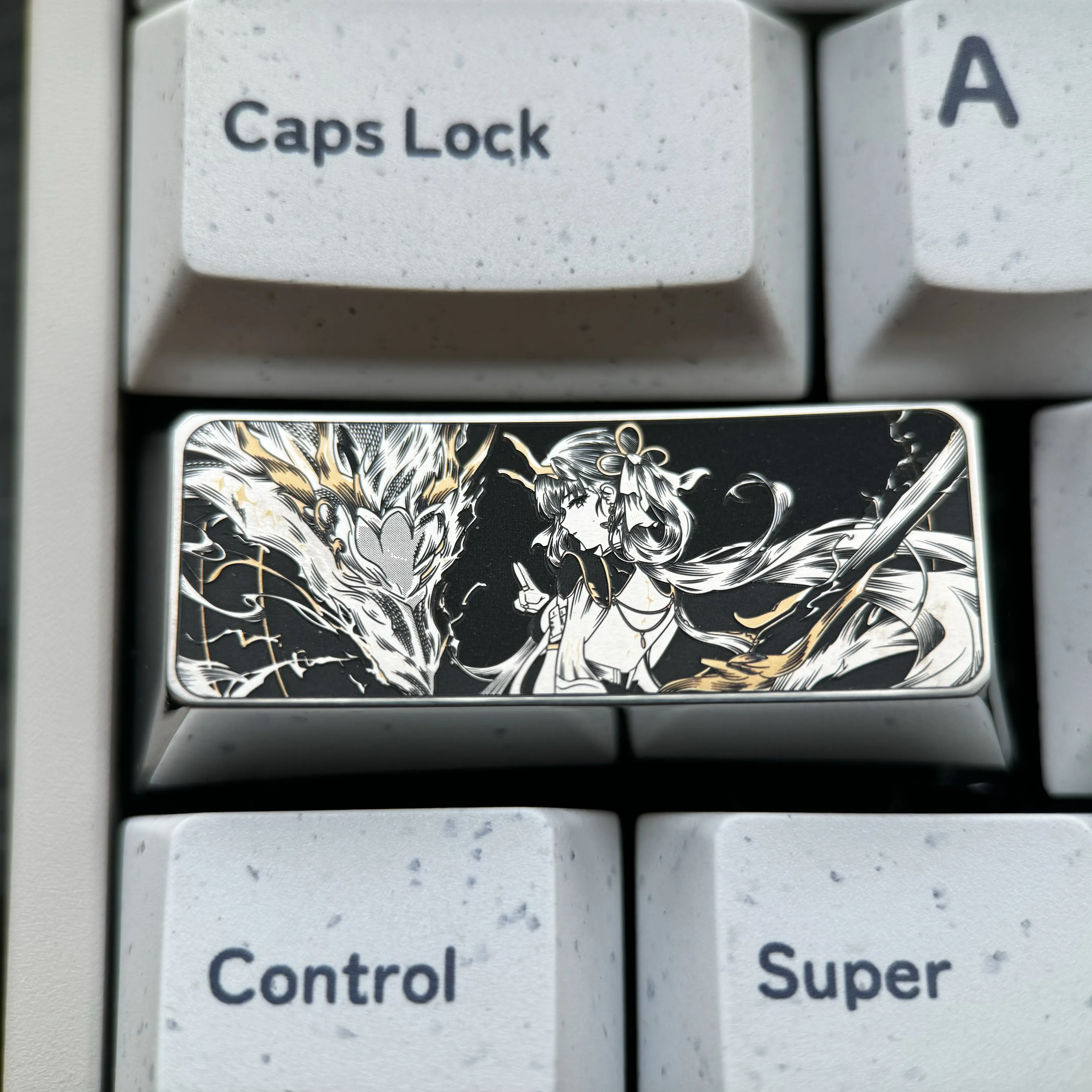 Close-up of a precision-engraved titanium keycap, showcasing intricate vibrant designs and lustrous finish, elevating keyboard artistry.