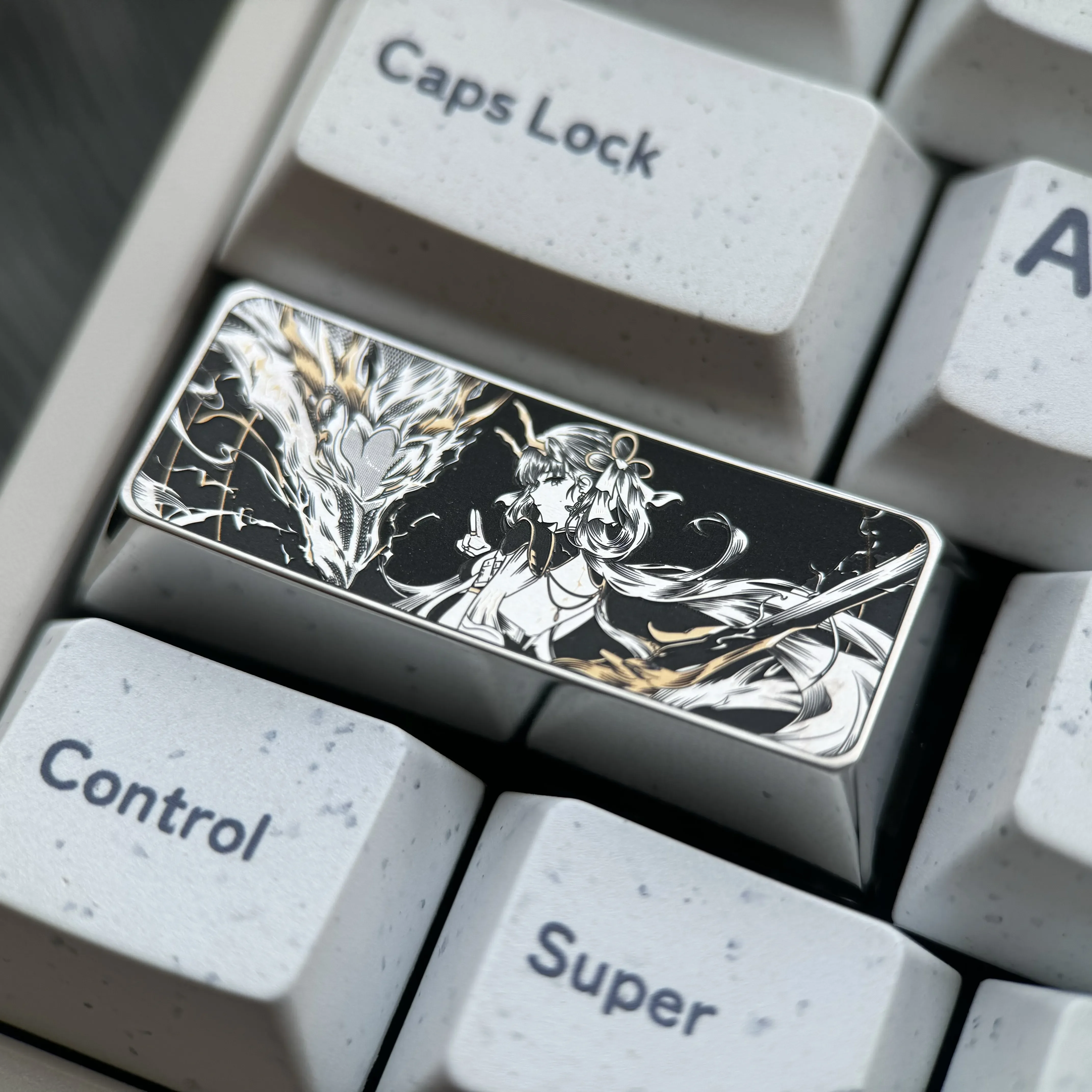 Gallery views of the precision-engraved titanium keycap, highlighting its intricate 2.25u design, lustrous finish, and premium keyboard