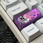 Vibrant Yae Miko titanium artisan keycap displaying intricate Genshin Impact anime aesthetics and premium metal craftsmanship.