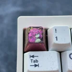 Exquisite anodized titanium Yae Miko keycap showcasing its mystical red hue with crystalline shimmer, embodying divine elegance for custom purpose.