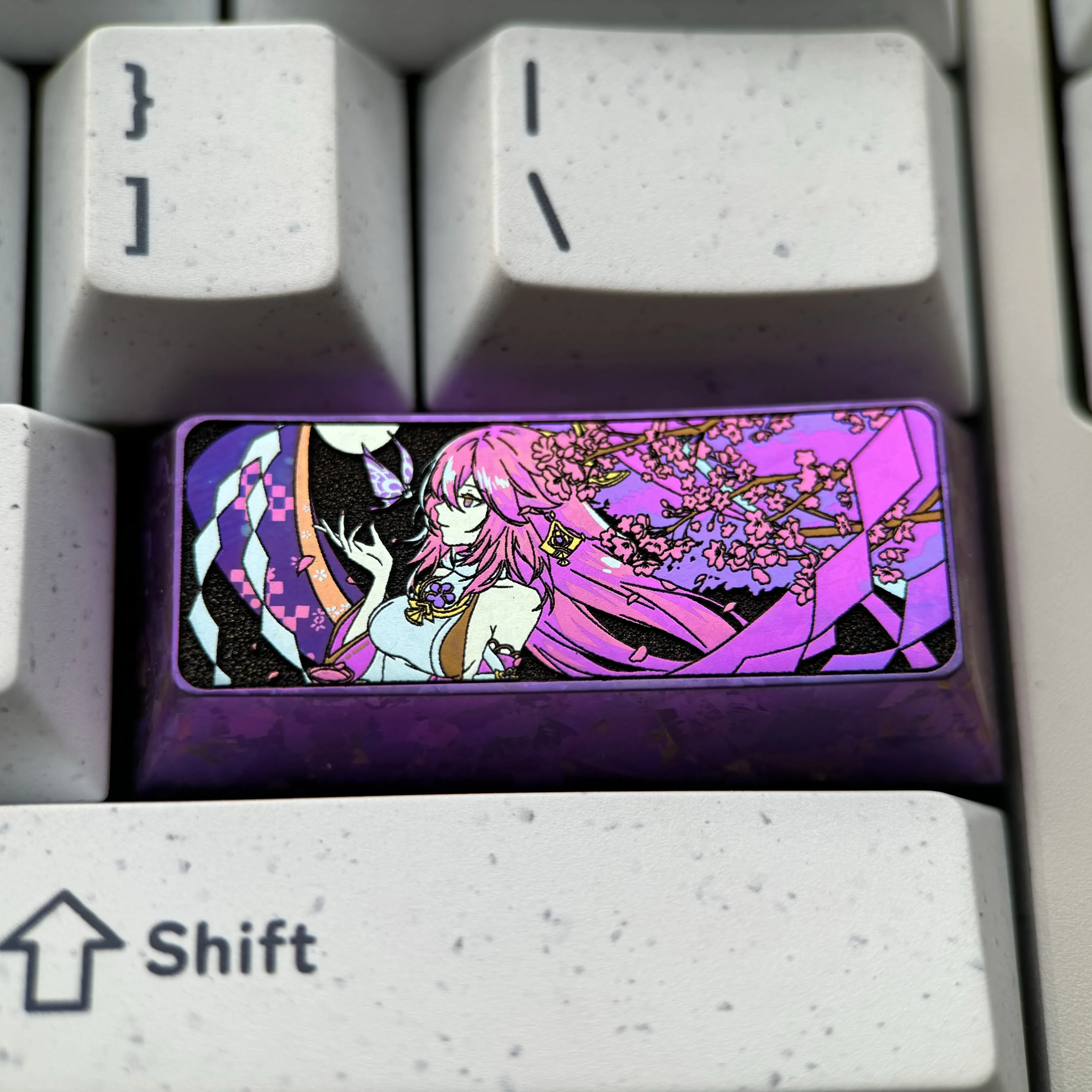 Exquisite Yae Miko Titanium Artisan Keycap, showcasing vibrant Genshin Impact anime aesthetics and intricate details crafted from lustrous metal.